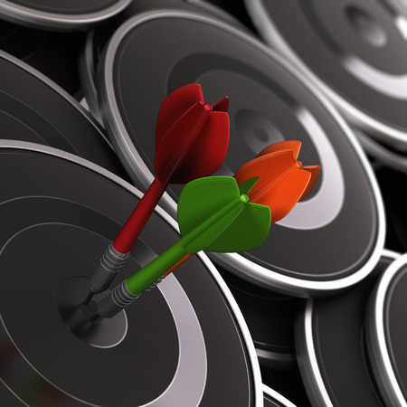 Three darts in the center of a black target, with many other ones around it. Concept image to illustrate business performance or excellence.の写真素材