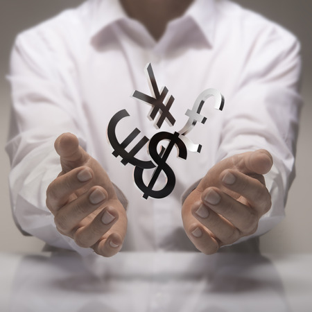 Man hands holding currencies symbols. currency exchange service concept.の写真素材