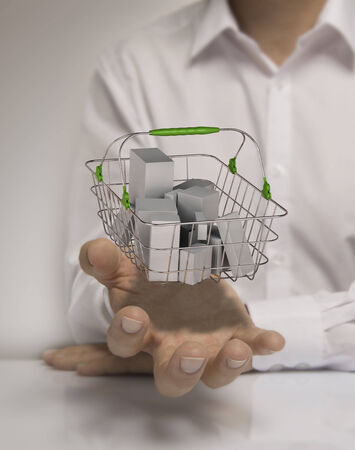 One man with basket containing generic goods at the top of open hand, concept of consumerism.の写真素材