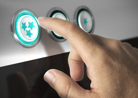 One finger pressing a three stars button, image concept of rating or excellent quality.の写真素材