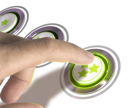One finger pressing a three stars button over white background, image concept of rating or excellent quality.の写真素材