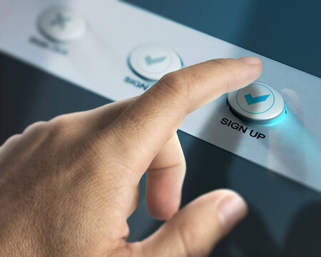 One finger pressing a sign up button over aluminum background, concept image for registration of new member.の写真素材