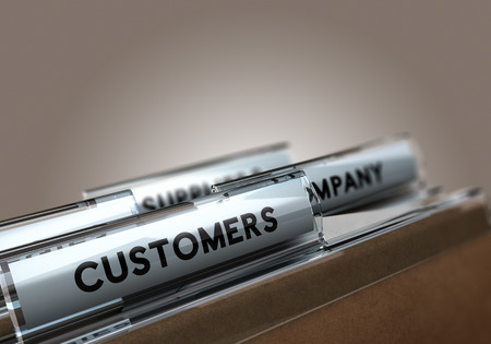 Folder tab with the text customers with focus on the word and blur effect. Concept image for customer management.の写真素材