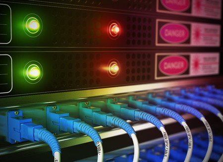 Close up of network infrastructure in data center. Blur effect with focus on patchcords at the foreground.の写真素材