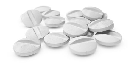 Many pills or tablets over white background symbol of medication.の写真素材