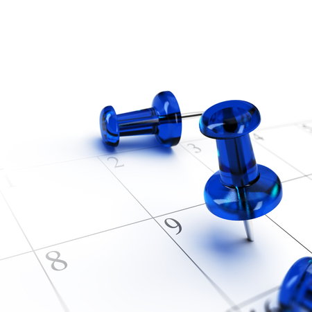 One blue pushping pointing a schedule over white background. concept of setting an appointment.の写真素材