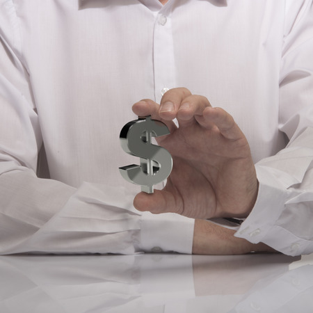 hand holding dollar sign, white shirt and reflexion. symbol of profit and making moneyの写真素材