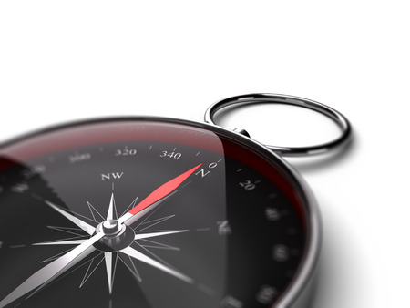 Compass pointing the north over white background suitable for bottom left angle of a page. Black dial and red needleの写真素材
