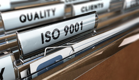 Close up on a file tab with the word ISO 9001, focus on the main text and blur effect. Concept image for illustration of Quality Standards Close up on a file tab with the word ISO 9001, focus on the main text and blur effect. Concept image for illustration of Quality Standards