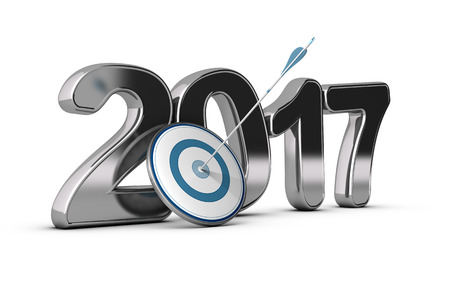 3D metallic Year 2017 with a target at the foreground with an arrow hitting the center, concept image for achieving business objectives in two thousand seventeen.の写真素材