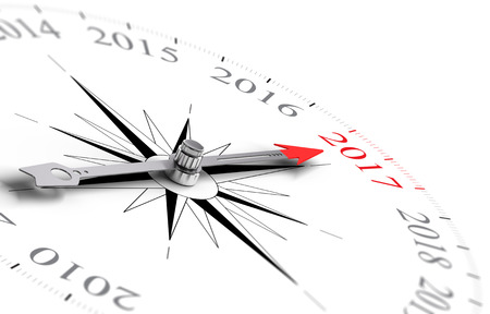 Conceptual compass with needle pointing the year 2017, black and red tones over white background. Concept image for illustration of future and ancipation of two thousand seventeen.の写真素材