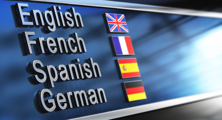 English, French, Spanish and German written on a building facade.の写真素材