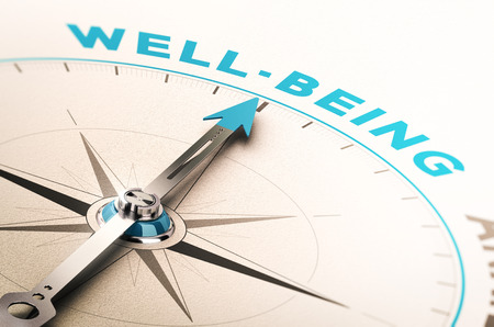 Compass with needle pointing the word well-being. 3D illustration with blur effect. Concept of wellbeing or wellness の写真素材