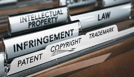 3D illustration of a folder, focus on a tab with the word infringement. Conceptual image of copyright law の写真素材