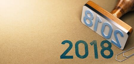 3D illustration of a rubber stamp with the year 2018 stamped on recycled paper background. Two Thousand Eighteen agenda concept.の写真素材