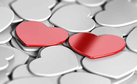 3D illustration of many white heart shapes and two red ones side by side. Abstract concept of love matchmakingの写真素材