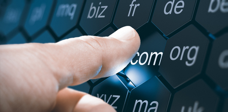 Man selecting a domain extention by pressing an hexagonal button. Composite image between a hand...