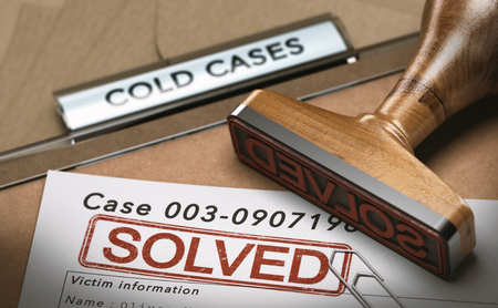 3D illustration of a cold case file with a rubber stamp and the word solved. concept of successful police investigationsの写真素材