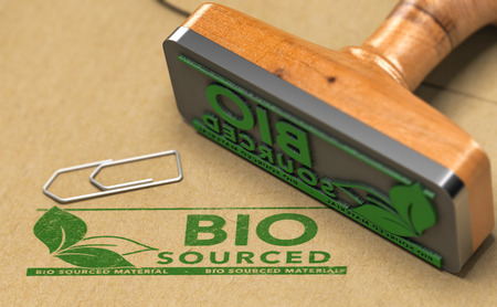 Biocourced material stamped with green color on paper background with rubber stamp. 3D illustration.の写真素材