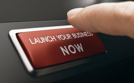 Finger pressing a red button with the text launch your business now. Concept of new venture or startup. Composite image between a hand photography and a 3D background.の写真素材