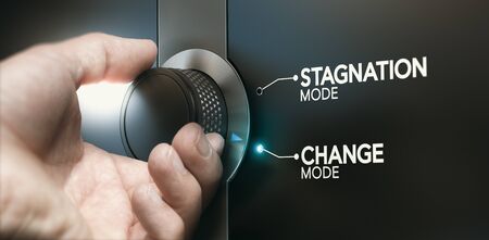 Man turning a switch to overcome stagnation and to take the opportunity of a career evolution. Composite image between a hand photography and a 3D background.の写真素材