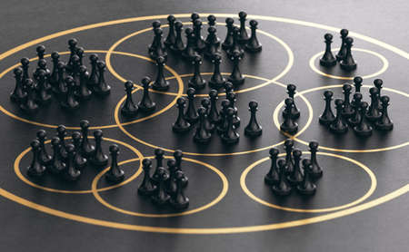 3D illustration of many pawns grouped together into golden circles over black background. Market segmentation concept.の写真素材