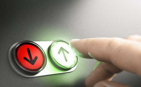 Man pressing a green button with an arrow on a simple board. Composite image between a hand photography and a 3D background.の写真素材