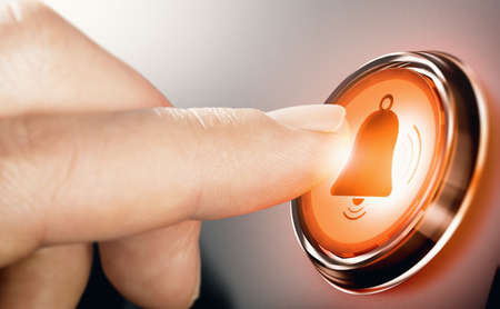 Finger pressing bell button to enable notifications. Composite image between a hand photography and a 3D background.の写真素材