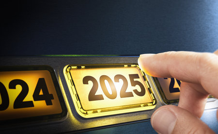 Finger about to press a yellow button with the text 2025. Year two thousand and twenty five concept. Composite image between a hand photography and a 3D background.の写真素材