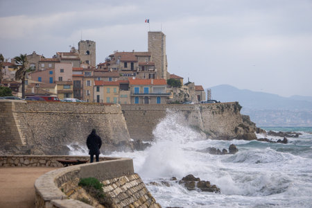 Man gazing at storm, old town, waves, Antibesの写真素材