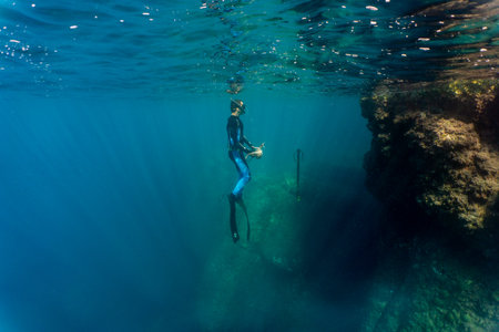 A man spearfishing in the seaの写真素材