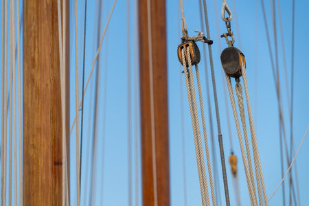 Web of braided ropes on many sail boatsの写真素材