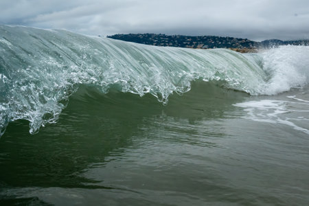 A wave about to crash in the seaの写真素材