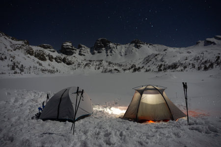 Two tents, camping in the snow, starry skiesの写真素材