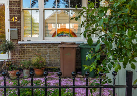 London/UK - 29/4/20 - Pictures of rainbows and put up in windows during the covid-19 crisisのeditorial素材
