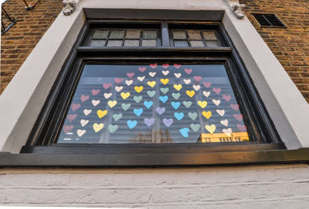 London/UK - 29/4/20 - Pictures of rainbows and put up in windows during the covid-19 crisisのeditorial素材
