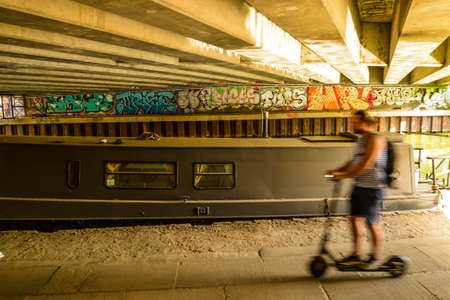 London/UK - 9/8/20 - People cycling along a canal in Londonのeditorial素材