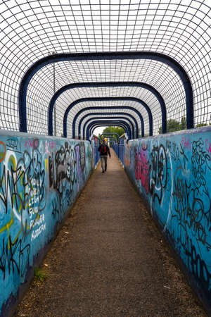 London/UK - 08/1/20 - A man walking through a tunnel bridge in Leytonのeditorial素材