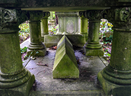 London/UK. 12.2.20. Graves surrounded by dense undergrowth in the atmospheric western part of Highgate Cemetery in north Londonのeditorial素材