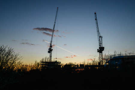 A sunset behind a large construction site in Walthamstow in Londonのeditorial素材
