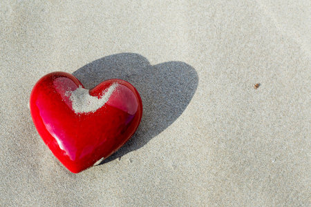 a red heart on the sandの写真素材