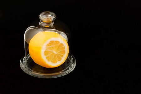 lemon in a glass lemongrass on a black background. Copy space.の写真素材