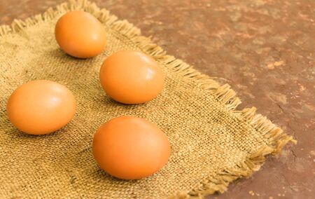 Fresh chicken eggs on the table.の写真素材