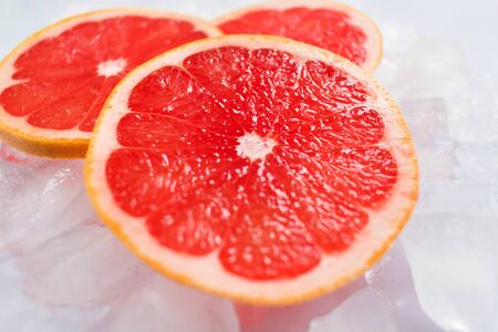 Grapefruit slices on ice. Close-up.の写真素材
