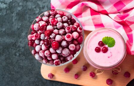 Frozen cranberry yogurt on a black background. The concept of healthy desserts. Top view.の写真素材