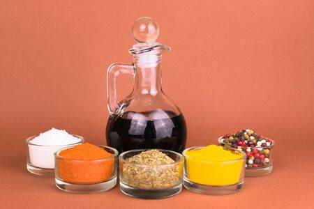 Soy sauce in a decanter and various spices. Close-up.