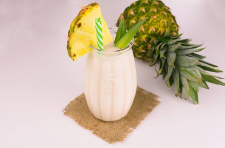 Pineapple milkshake on a white background. Pineapple smoothie.の写真素材