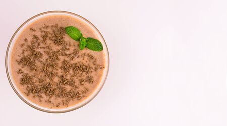 Chocolate milkshake in a glass on a white background. View from the top. Copy space.の写真素材