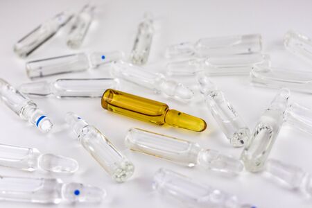 A lot of ampoules for injections on a white background. Production of medical preparations.の写真素材
