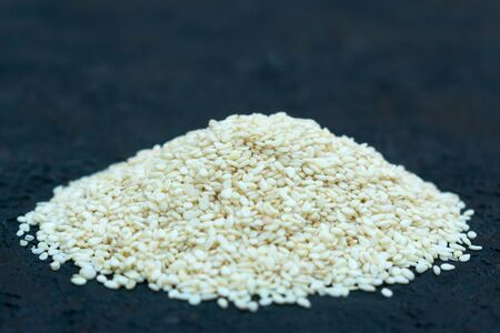 Sesame seeds on a black background. Copy space.の写真素材